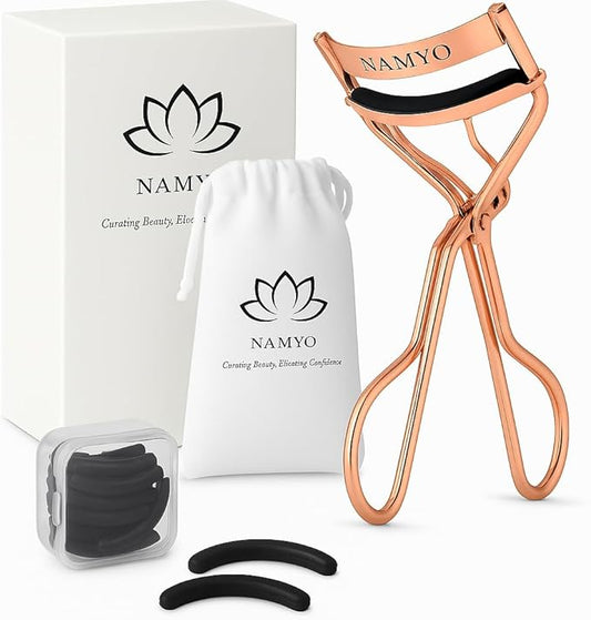 Namyo Premium Eyelash Curler Rose Gold Edition - Makeup Eyelash Tool with Lasting Lift and Precision Curl. Holiday Gift Ready Packaging. Soft Grip. Extra Silicone Refills. Travel Ready.